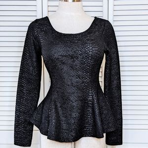 Black peplum top with snakeskin imprint